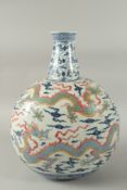 A VERY LARGE CHINESE POLYCHROME BLUE AND WHITE PORCELAIN DRAGON VASE, with four colourful dragons