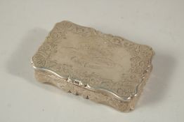 A VICTORIAN ENGRAVED SILVER SNUFF BOX, 8cms long. London 1879. Weight: 116grms.