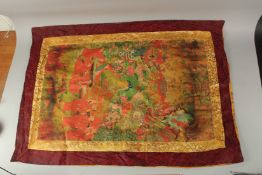 A TIBETAN THANGKA on silk.