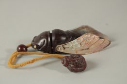 A HARDWOOD AND MOTHER-OF PEARL FLY INRO with rope. Signed. 11cms long.