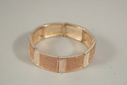 A DIAMANTE BRACELET, boxed.