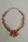 A CORAL SET NECKLACE.