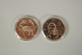 TWO MEDALLIONS, SCORPIO AND CANCER.