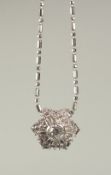 A DIAMOND SNOWFLAKE CLUSTER, PLATINUM, approx. 0.50ct, with 18ct white gold chain.