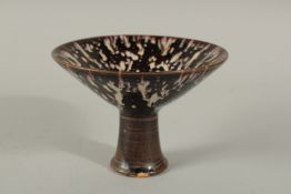 TWO CHINESE JIAN WARE STEM CUPS, each 15.5cms diameter.