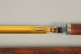 A RARE 19TH CENTURY WALKING STICK with metal top and two screw off sections revealing a long glass