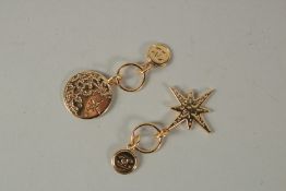 A PAIR OF CHANEL GILT CHARMS.
