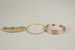 THREE VARIOUS BRACELETS.