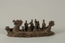 A CHINESE BRONZE DRAGON BOAT. 15cms long.
