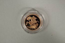2019. A FULL GOLD PROOF SOVEREIGN in capsule FDC with wooden box and COA plus outer.