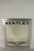 A BENTLEY ADVERTISING MIRROR. 60cms x 48cms.