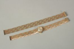 A 9ct GOLD BUECHE-GIROD WRISTWATCH AND BRACELET, with a spare bracelet. Approx. 30grms.