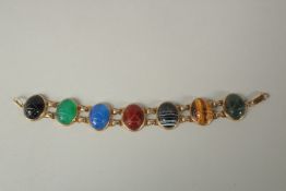 A 14ct GOLD BRACELET set with seven agate stones.
