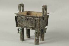 A GOOD ARCHAIC BRONZE RECTANGULAR TWO-HANDLED CENSER. 20cms high.
