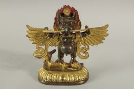 A TIBETAN BRONZE DEITY. 20cms high.
