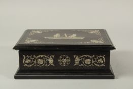 A 19TH CENTURY ITALIAN BONE INLAID BOX with classical designs. 11ins long.