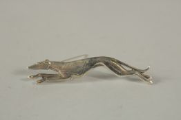 A SILVER GREYHOUND BROOCH.