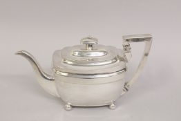 A GEORGE III SILVER TEAPOT on four ball feet. London 1799. Weight 18ozs.