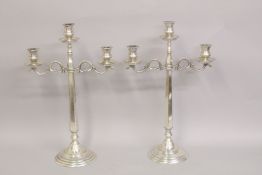 A LARGE PAIR OF TWO-BRANCH CANDELABRA. 57cms high.