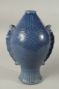 A CHINESE BLUE GROUND FISH VASE. 32cms high.