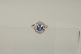 A PLATINUM, CYCLONE SAPPHIRE AND DIAMOND DECO RING.