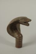 A BRONZE WALKING STICK HANDLE 'COBRA'.