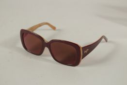 A PAIR OF MAUI LANI SUNGLASSES, boxed.