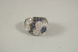 A GOOD SILVER DIAMANTE AND BLUE STONE RING, boxed.