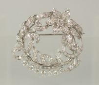 AN ALL DIAMOND (approx 4+ cts) PLATINUM BROOCH, in a fitted case.