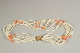 A PEARL AND CORAL SIX-ROW NECKLACE, in a De Wan bag.