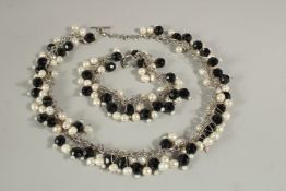 A BESARANI CRYSTAL AND PEARL NECKLACE AND BRACELET.