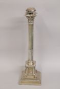 A LARGE CORINTHIAN COLUMN SILVER LAMP on a stepped square base. London 1908. 53cms high.