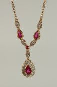 A RUBY AND DIAMOND DEMI-NECKLACE, 18ct hallmarked yellow gold.