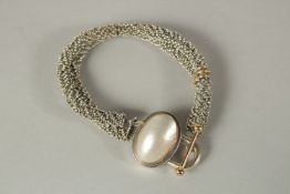 A MICHAEL DAWKINS SILVER AND PEARL BRACELET.