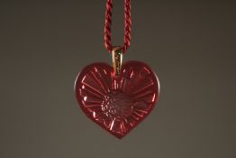 A LALIQUE PINK HEART PENDANT in a Lalique box.