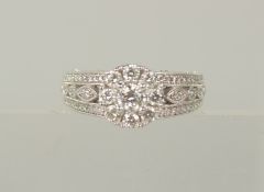 AN ALL DIAMOND CLUSTER RING, 18ct gold, hallmarked.