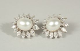 A PAIR OF 18ct WHITE GOLD SOUTH SEA PEARLS, 14mm x 11.5mm, and diamond 8ct plus, earrings.