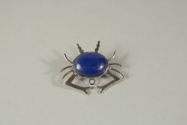 A SILVER AND LAPIS SPIDER BROOCH.