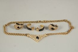 A DIAMANTE NECKLACE AND TWO PAIRS OF EARRINGS in a blue bag.