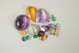 A SMALL BOX OF SEMI-PRECIOUS STONES.