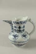 A CHINESE BLUE AND WHITE PORCELAIN EWER, with lotus and lucky symbols. 20.5cms high.