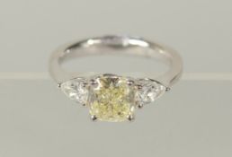 A YELLOW DIAMOND 1.51cts, NATURAL YELLOW RING, sidestones 0.55cts.