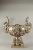A SUPERB SILVER PLATE CENTREPIECE OF MUSEUM QUALITY, with classical female handle, the body with