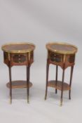 A PAIR OF LOUIS XVITH DESIGN OVAL MAHOGANY INLAID BEDSIDE TABLES with brass gallery, three