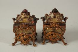 A PAIR OF 19TH CENTURY CONTINENTAL GILT METAL JEWEL BOXES of square form, with four panels of