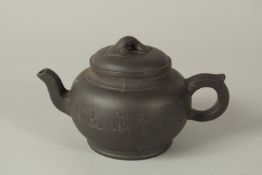 A CHINESE YIXING PURPLE CLAY TEAPOT WITH CARVED CHARACTERS AND RUYI FINIAL, the base with