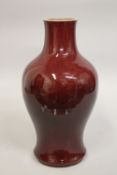 A LARGE CHINESE SANG DE BOUEF PORCELAIN BALUSTER VASE, 38cm high.