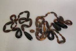 A COLLECTION OF LARGE CARVED VICTORIAN BEADS - POSSIBLY RHINO HORN.