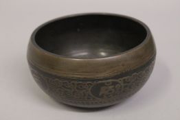 A FINE 19TH-20TH CENTURY TIBETAL ETCHED SINGING BOWL, 13.5cm diameter.