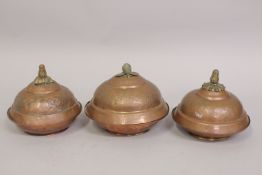 A SET OF THREE 18TH CENTURY OTTOMAN TURKISH GILT COPPER TOMBAK LIDDED DISHES, (3).